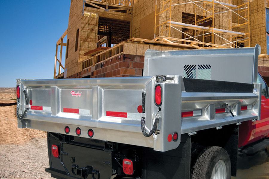 Rugby Mfg. Dump Trucks Concrete Construction Magazine