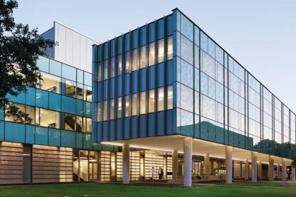 The two enclosed floors of the northern volume are supported by 18 poured-in-place concrete columns. And in a break from Rice's brick-and-masonry vernacular, the northernmost facade is glazed to capture indirect light, and silk screened with a blue Penrose pattern to mitigate glare.