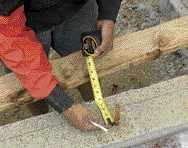 Then measures the distance between each bolt and the layout line.