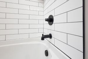 According to Six3Tile, their panels install faster than traditional tile and can be grouted immediately with standard unsanded grout.