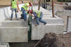 The 6-inch longitudinal joints between adjacent modular beam segments and moment-resisting transverse superstructure joints at each pier are ultra-high-performance concrete.