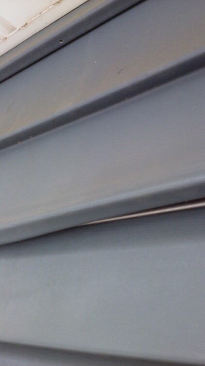 Here the separated panel is partially engaged with an added strip from a metal starter.