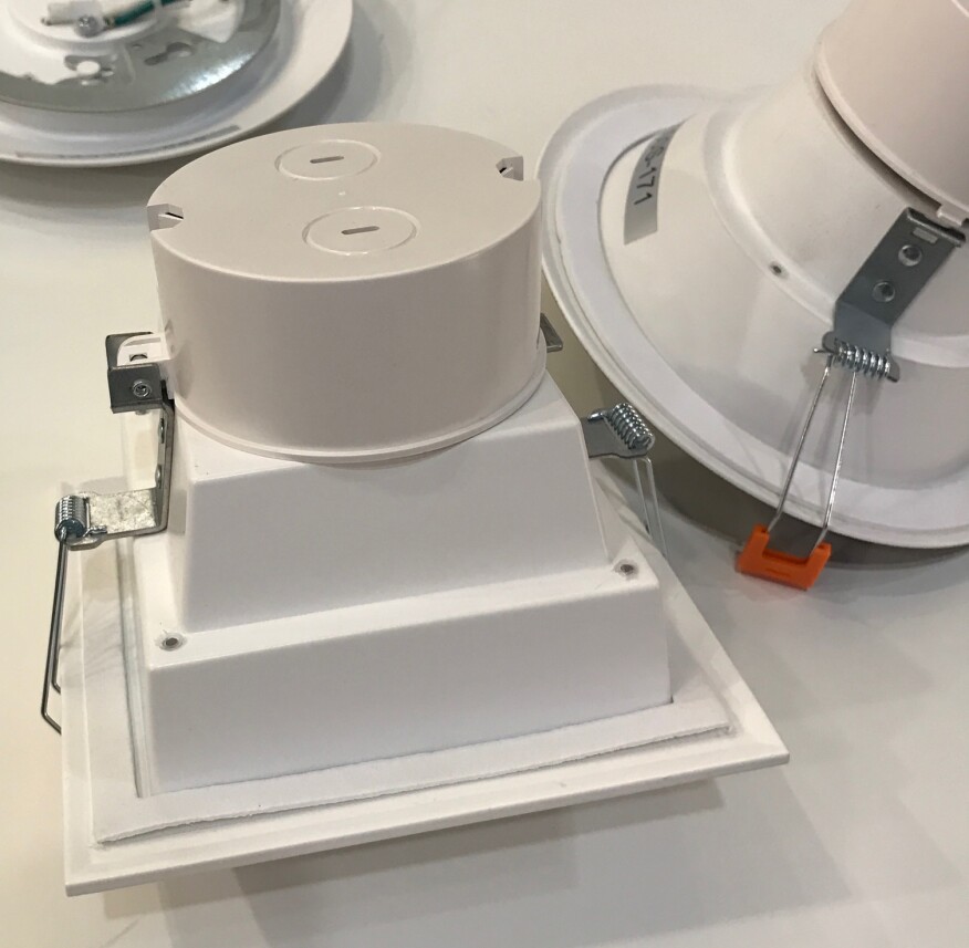 A variety of LED fixtures available these days provide better options where recessed lights are demanded. The fixtures shown in the foreground have plastic housings that are virtually free of air leaks, and provide a simple plug-and-play connection that is completely separate from the lamp housing; the electrical connection won't penetrate a ceiling air barrier.