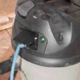 A green light tells you that a tool is connected and the vac is ready for dust collection. Once the tool is shut off, the vac continues running for a few seconds to clear the hose.