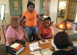 New Orleans evacuees fill out paperwork for a new apartment in Dallas.