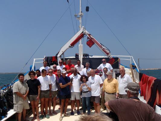 Goddio's team pose prior to another underwater excavation.