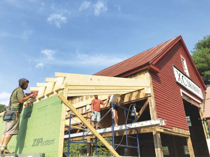 A shed addition adds to the building’s volume with modern insulated construction.
