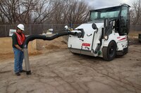 Front debris hose option available for sweeper