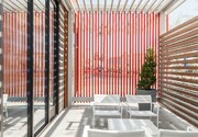 A steel trellis composed of rectangular tube steel sections protects the building from south sun exposure, while creating a canopy that highlights the entry and provides safe respite for showroom users and visitors.