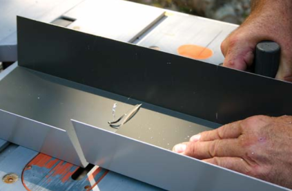 Cutting the flashing on the table saw prevents the distortion created by using snips.