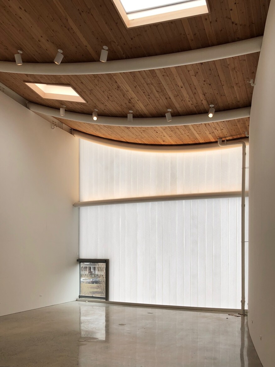 Interior rooms at the Winter Visual Arts Center such as this woodworking studio are filled with diffuse natural light that filters through channel glass, as well as through skylights and vision glass.