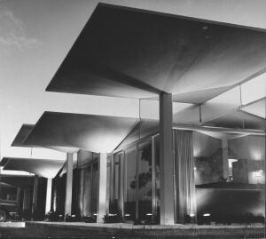 Parasol roof made of 75 concrete umbrellas joined with plastic at new resort motel.