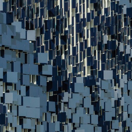 The west faces of the aluminum flaps are painted in royal blue.