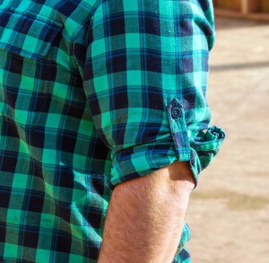 When you roll up a sleeve you can use a buttoned tab to keep it in place.