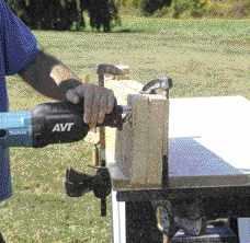 To simulate cutting out an old window opening, the author made test cuts on a 2x10 header with a 2x4 plate and plywood sheathing on one side.