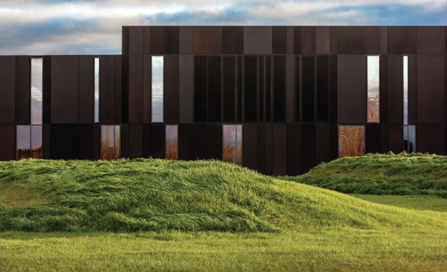 The aluminum and glazed skin was informed by the surrounding tree-lined landscape.