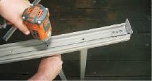 Screwing balusters to a subrail.