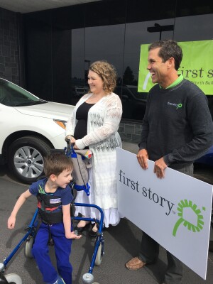 Hayden Watson introduces a First Story client and her son to their new wheelchair accessible home. 