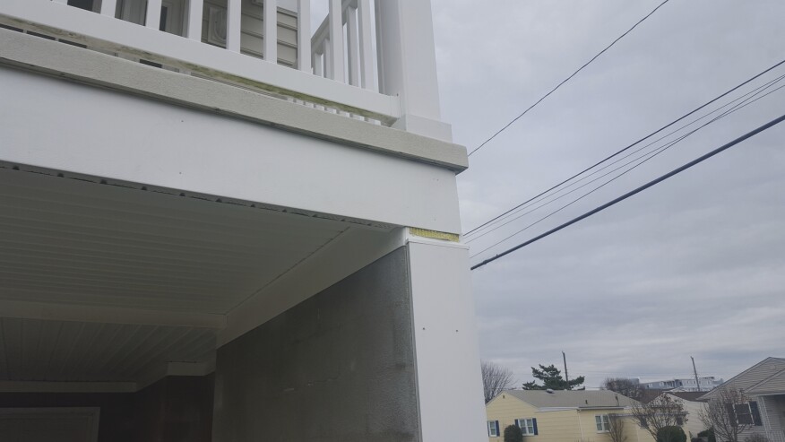 On the bottom of the beam, we installed vented soffit to allow water out and air in, and for both the exterior and interior sides of the upper beams, we used L-shaped bends of aluminum capping.