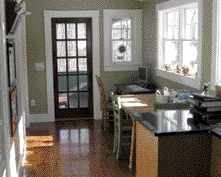 The remodeled kitchen contains a children's work station at one end.