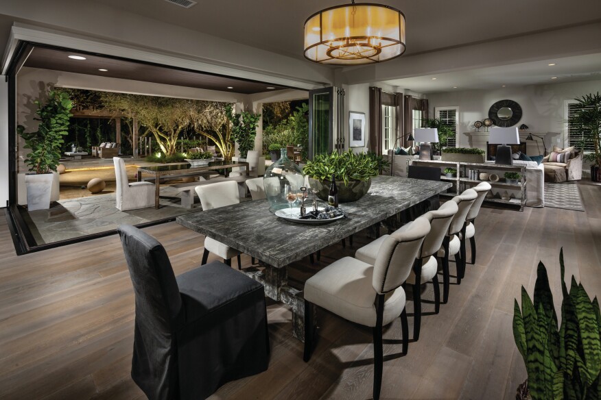 Oversized accordion doors make it possible to double a home’s entertaining capacity, whether its outdoor spaces are at grade (New Home Co., pictured) or perched high above (Pardee Homes, below).