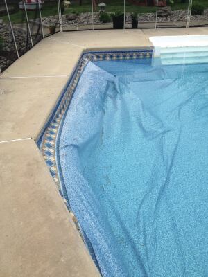 Battle of the bulge: Sometimes water from under the patio can become suspended by a low permeable soil, such as clay. When it is higher than the waterline in the pool, it can force the liner to float.