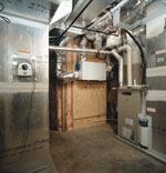 The home's HVAC system includes a UV bacteria killer, air filters, quiet zoning, air exchange control units, humidifiers, and zone controls. These systems help TNAH meet Building America and EarthCraft guidelines for energy efficiency and indoor air quality.