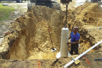 Each footing has an integral fitting for an eyebolt that was used to lift and place the footing. After the footings were placed, the crew used the fittings to attach the post connectors.