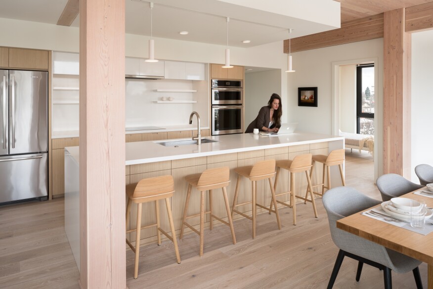 The condo interiors feature exposed Douglas fir columns, beams, and ceilings.