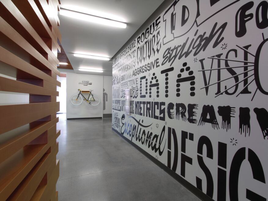 Circulation spaces echo Adobe's commitment to innovation through graphics and product displays.