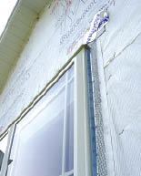 Flexible sealant is used to fill the joints between the J-mold and the window.