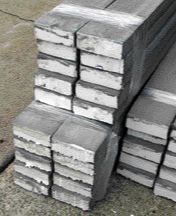 It will be covered with fiberglass mesh and given a faux stone finish. It's faster to use precoated foam; the material shown in the photo at right arrived on site with the mesh and a cementitious coating already on it.
