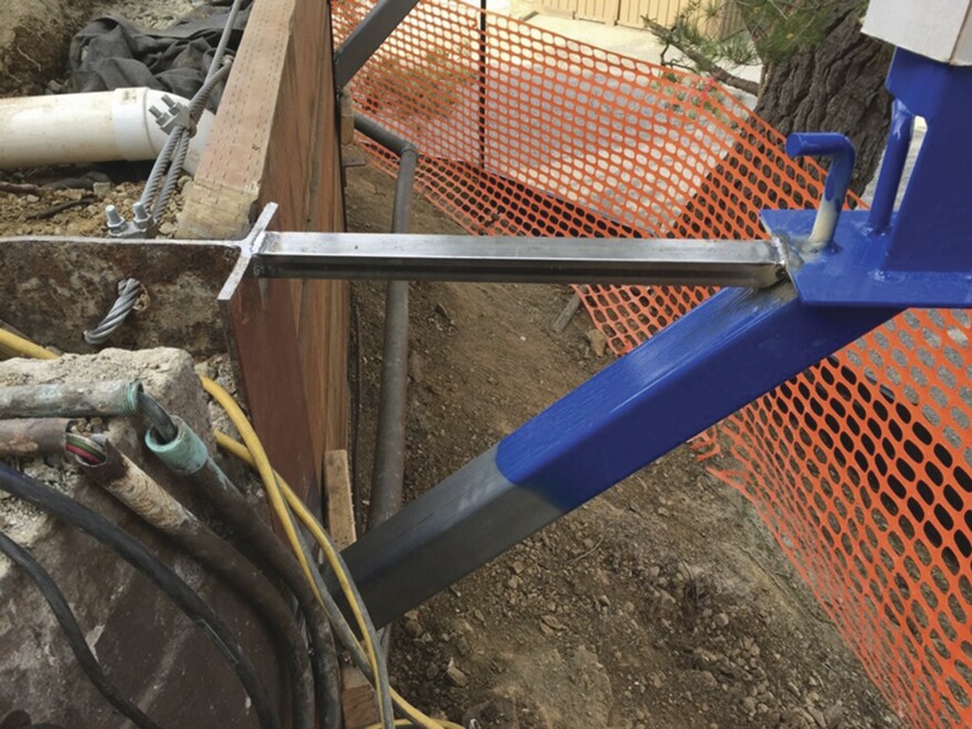 Horizontal steel tubes welded to both the columns and the guard posts stabilized the posts and helped support the Formlok panels when the concrete was poured.