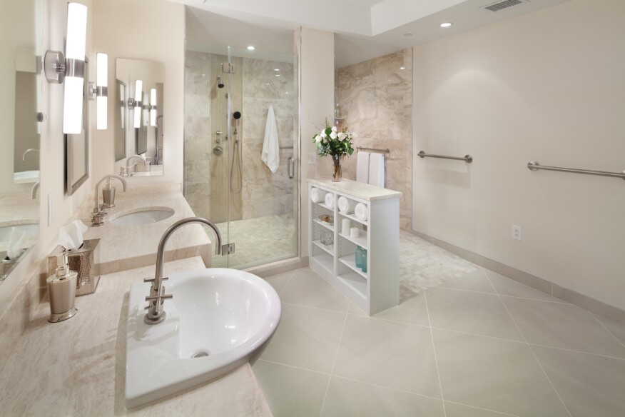 This bathroom by Glickman Design Build, which won a 2015 Chrysalis National Residential Universal Design Award, features accessible features such as grab bars, lever faucets, and a zero-threshold entry to the double shower.