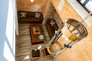 Built in 1955 and long vacant, the Sacred Heart Church has been adapted into a community living room, a mail room, and six rental units at the new 53-unit Sacred Heart at St. Bernard in New Orleans.