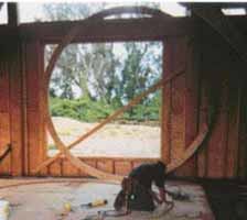 Two layers of 3/4-inch plywood, glued and nailed together with overlapping joints, formed the top and bottom plates of the tower's frame.