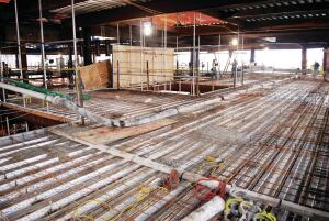 Versatility of the two placing booms allows multiple configurations including laying the telescopic boom flat, attaching the flexible hose and/or pipe sections to carry the concrete beyond the end of the boom, and pouring decks.