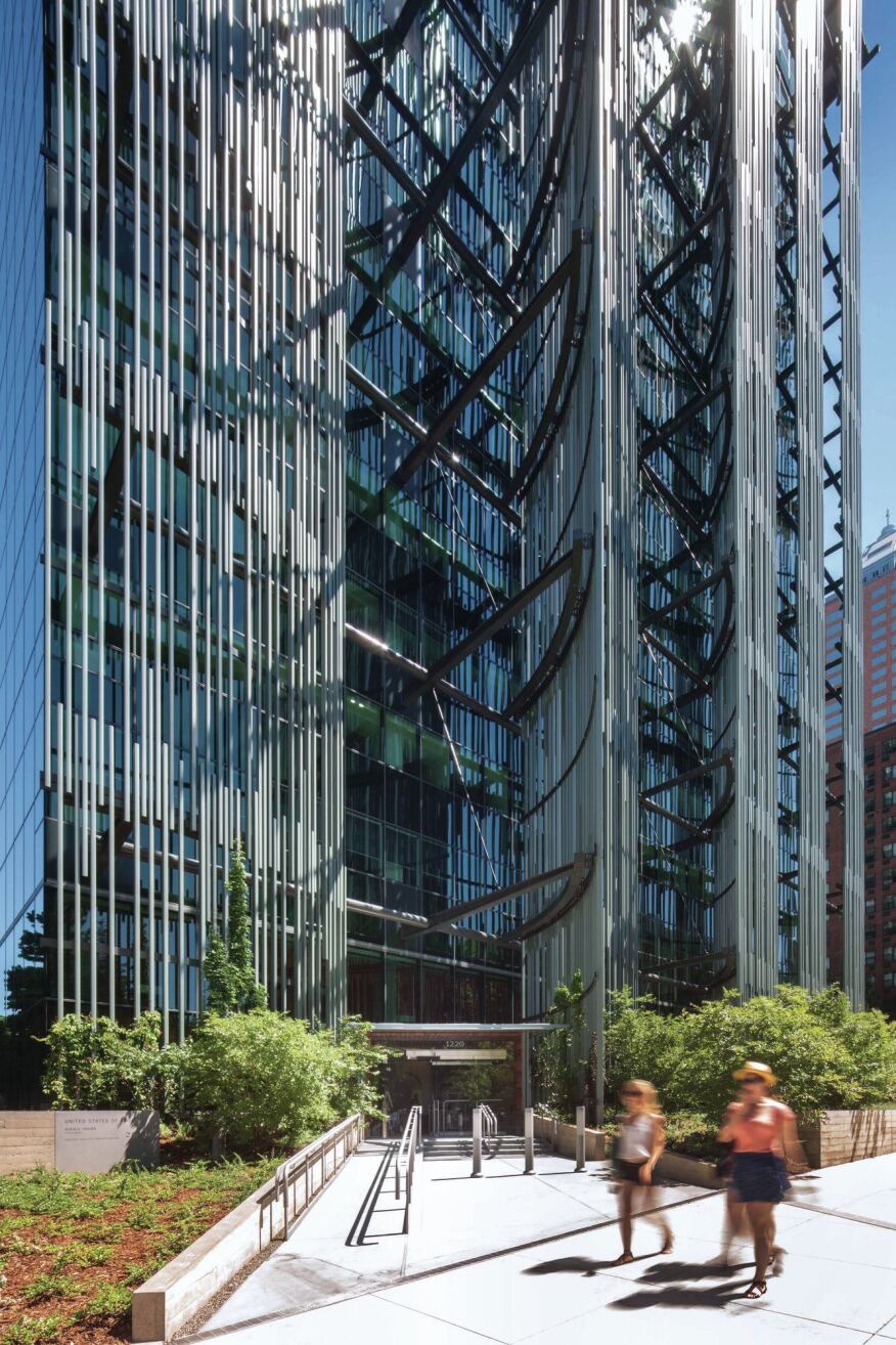 The aluminum “reeds” on the west façade are attached to a steel structure that shades the curtainwall to mitigate heat gain. Vegetation is being trained to grow around the frame to the height of the third floor.