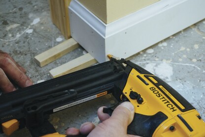 Pins hold the corner together until the glue sets.