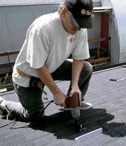 Metal flashings are installed upslope to divert rainwater from the penetration.