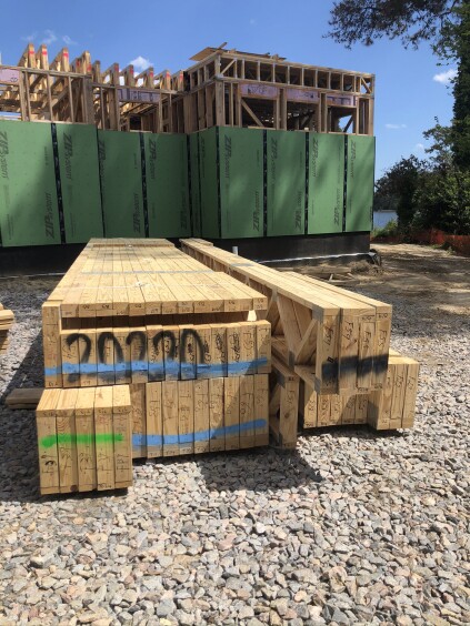 Floor-joist bundles are color-coded after the lumber drop.