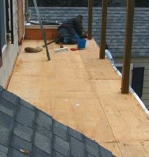 Before the plywood deck sheathing is installed.