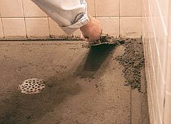 The screed strips are then removed and the voids filled with mortar.