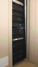 The theater in this house is part of a larger home automation system. All the electronic components are housed at a remote location in a closet or rack room.