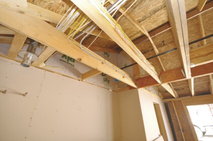 However, it proves to be an excellent backer for airsealing above the rim joist to the roofline. The reverse side of this sheathing was later insulated with 6 inches of closedcell foam.