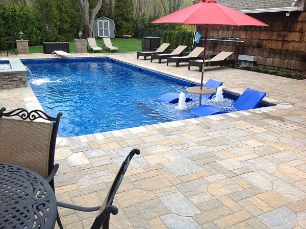 Scott Birkmaier, president of The Big Splash in Setauket, N.Y., remodeled his own pool to accommodate more lounging and splashing for his family. He didn’t use steel for the tanning ledge and interior stairs. Instead, he opted for vinyl-covered accoutrements formed of concrete.