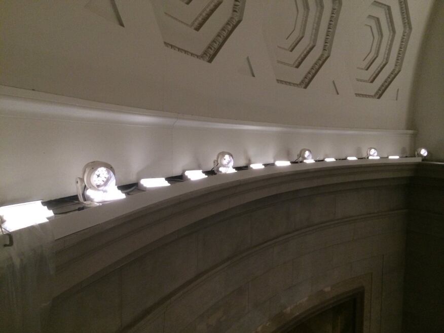 Three-tiered, 2850K linear LED fixtures light the rotunda ceiling, while narrow-beam spotlights are aimed to accent the murals and exhibit cases below.