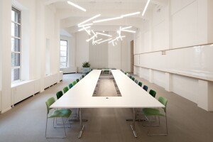 A meeting room in Spaces with pendant lighting fixture HALO Lineal.