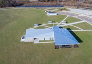 The radial site plan, responding to the geometry of the solar farm, creates a compact campus of related structures.
