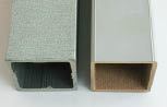 The mottled appearance of the single-layer composite at far left is due to the presence of partially exposed wood fiber; the cap layer of the co-extruded material to its right contains no fiber.